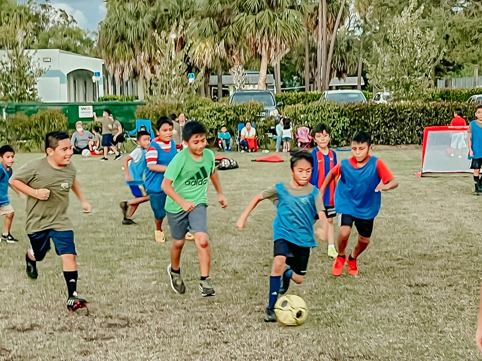 a group of kids playing football