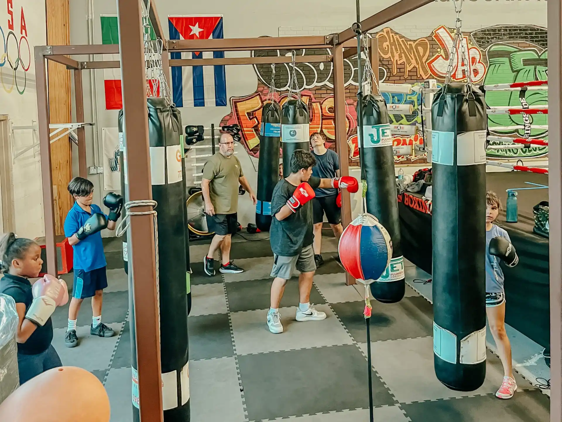 a group of people playing with a ball in a store