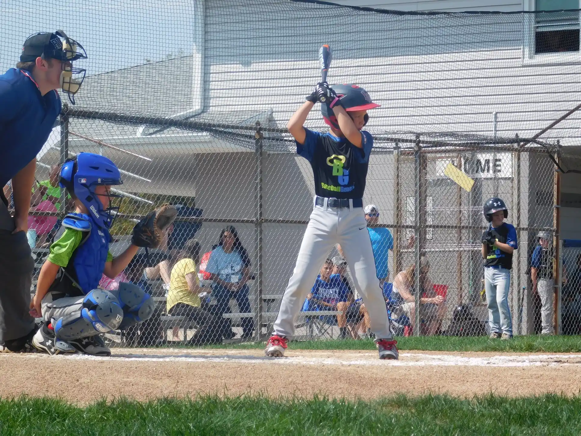 a baseball player prepares to swing a bat