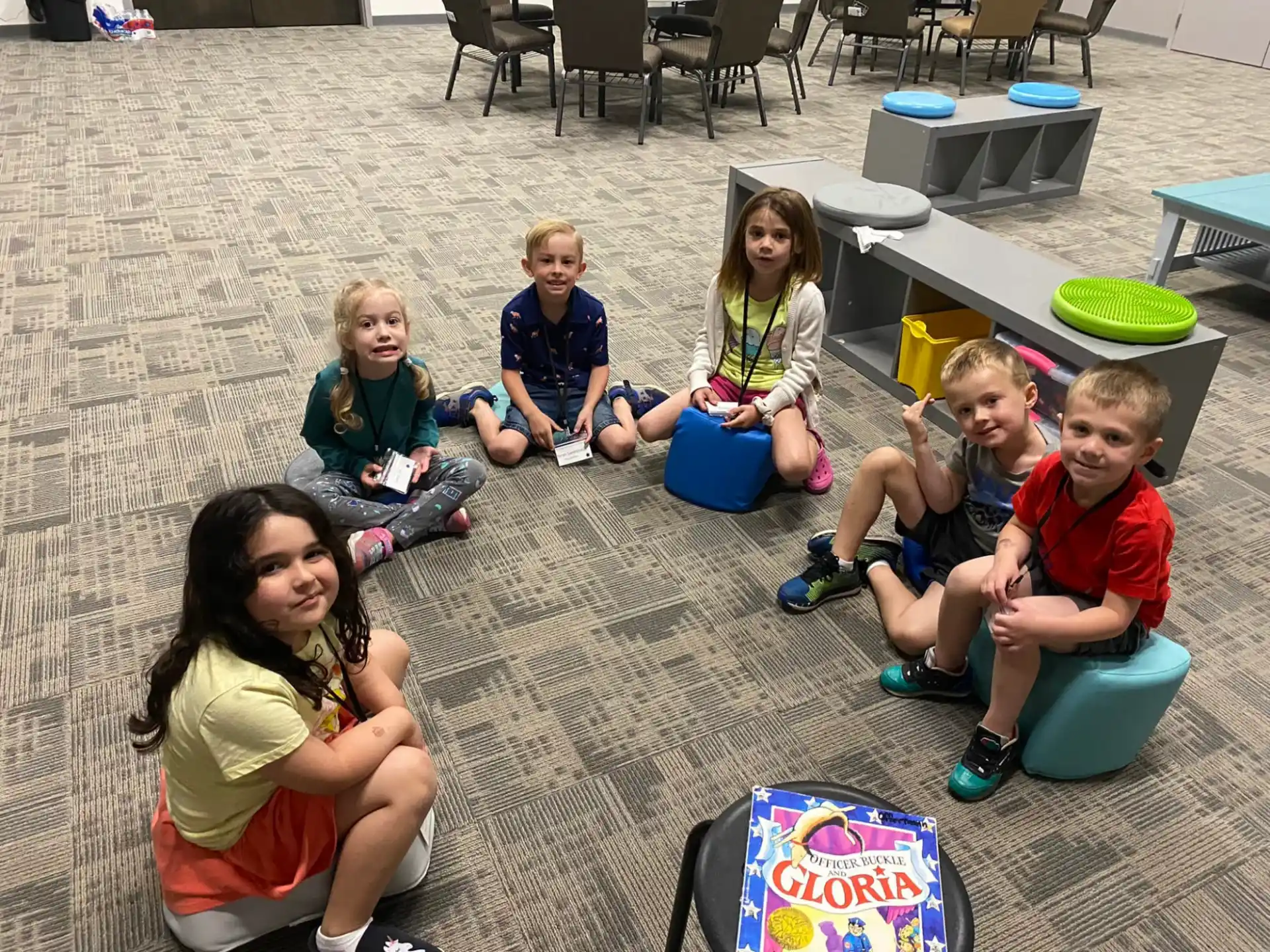 a group of children sitting on the ground