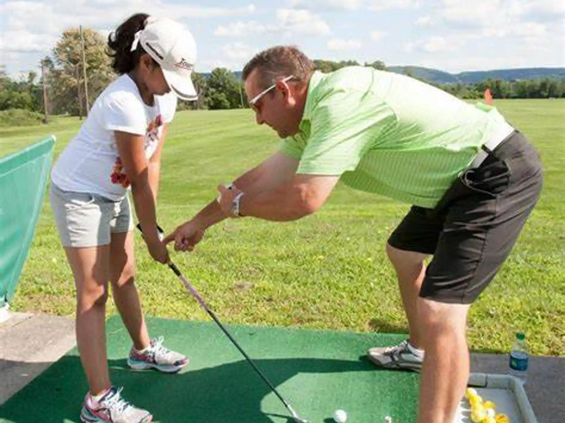 a man and a woman playing golf
