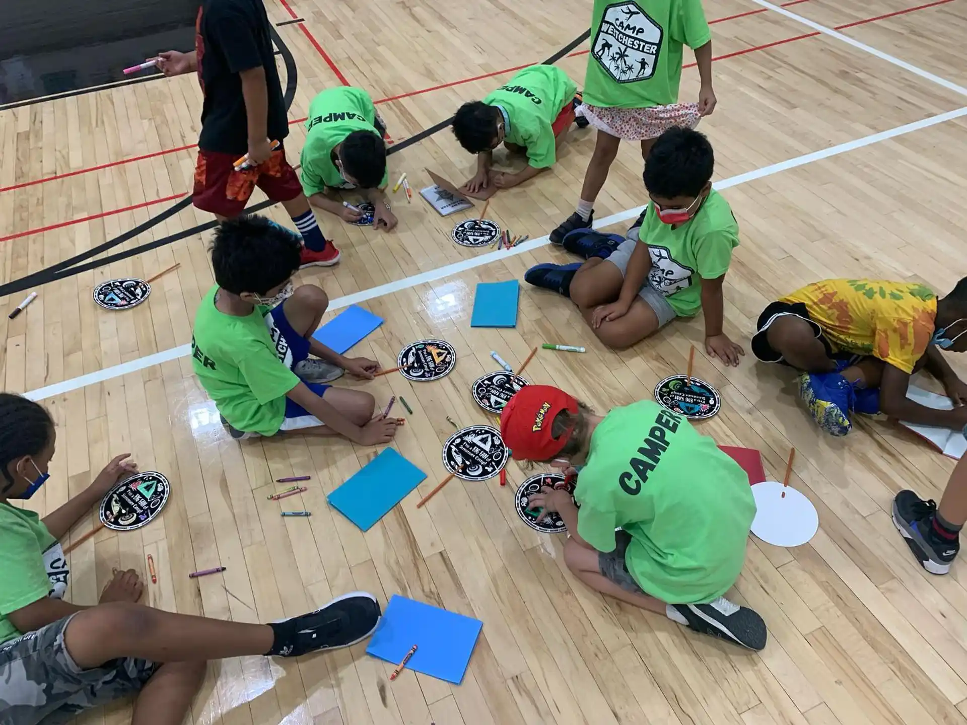 a group of people kneeling on the floor