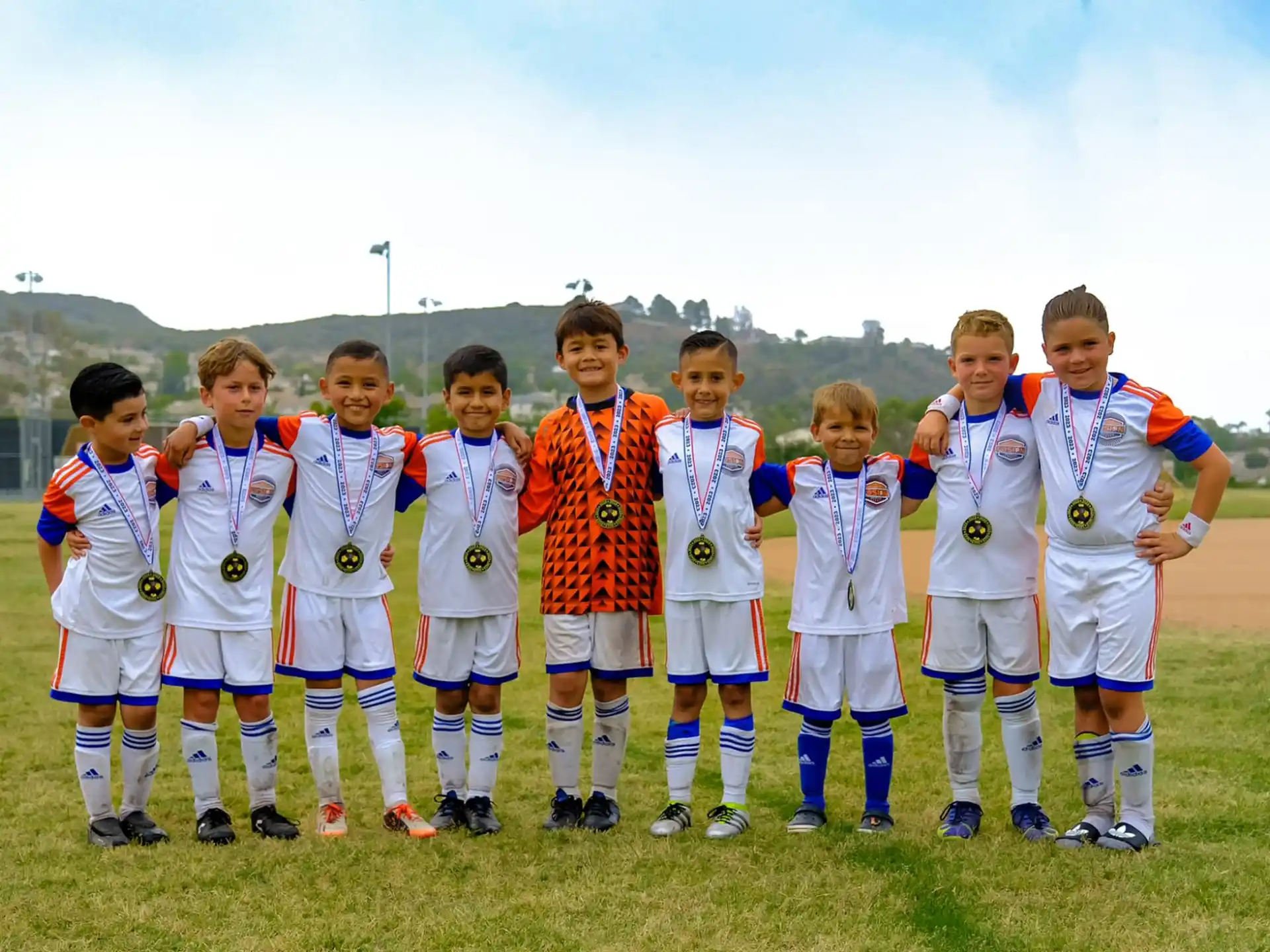 a group of football players posing for a photo