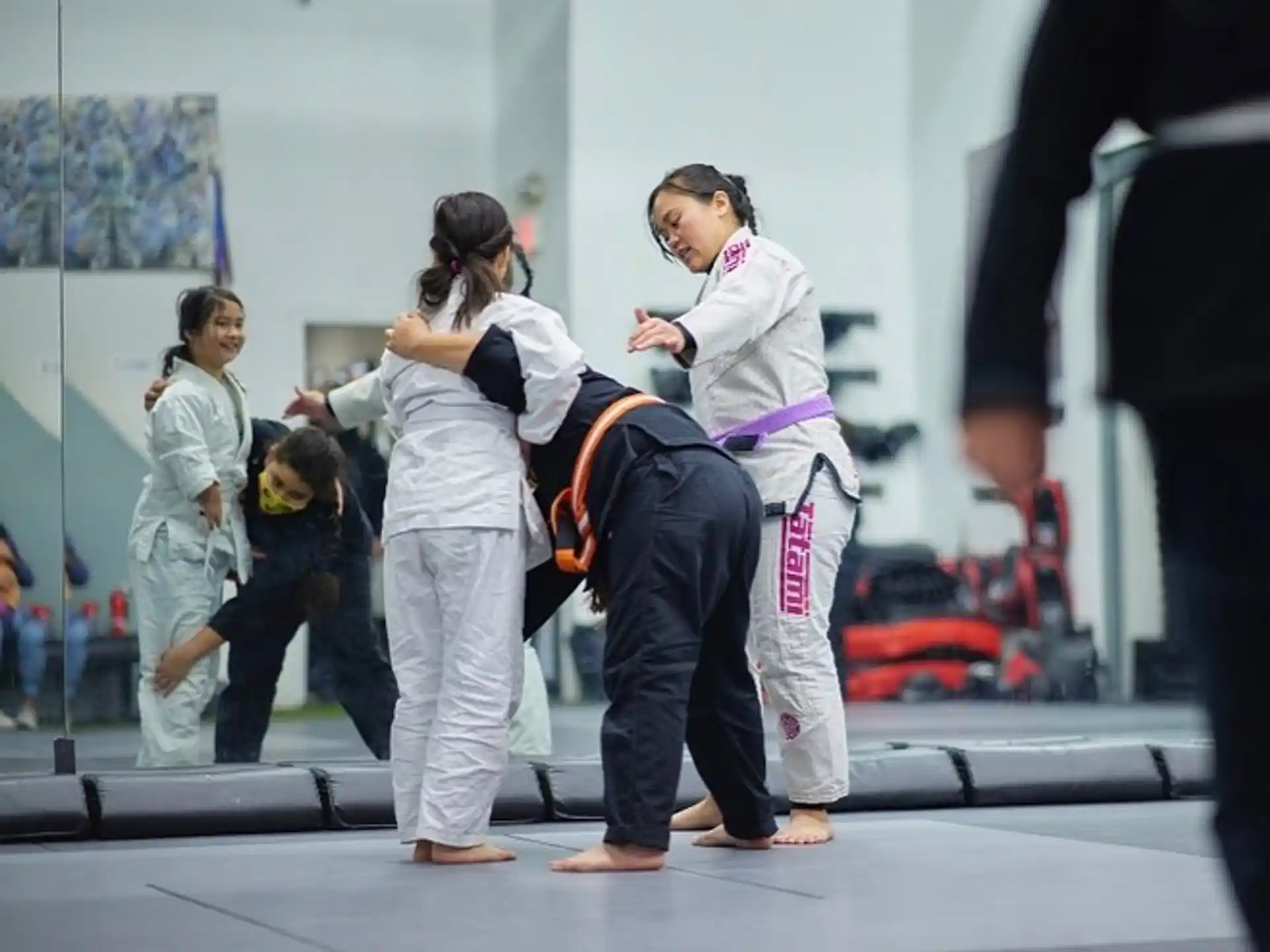 a group of people in karate uniforms