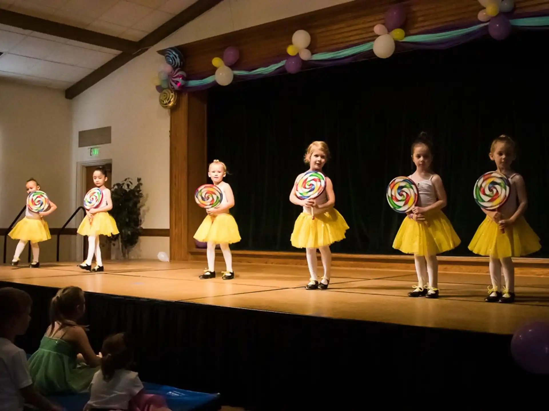 a group of children performing on a stage