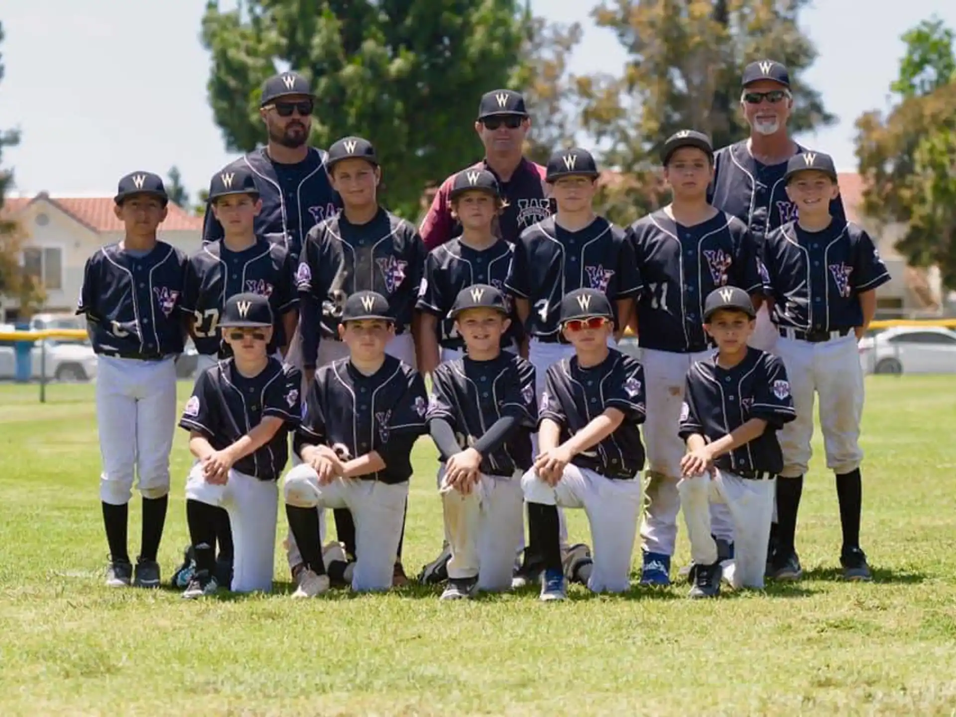 a group of baseball players posing for a photo