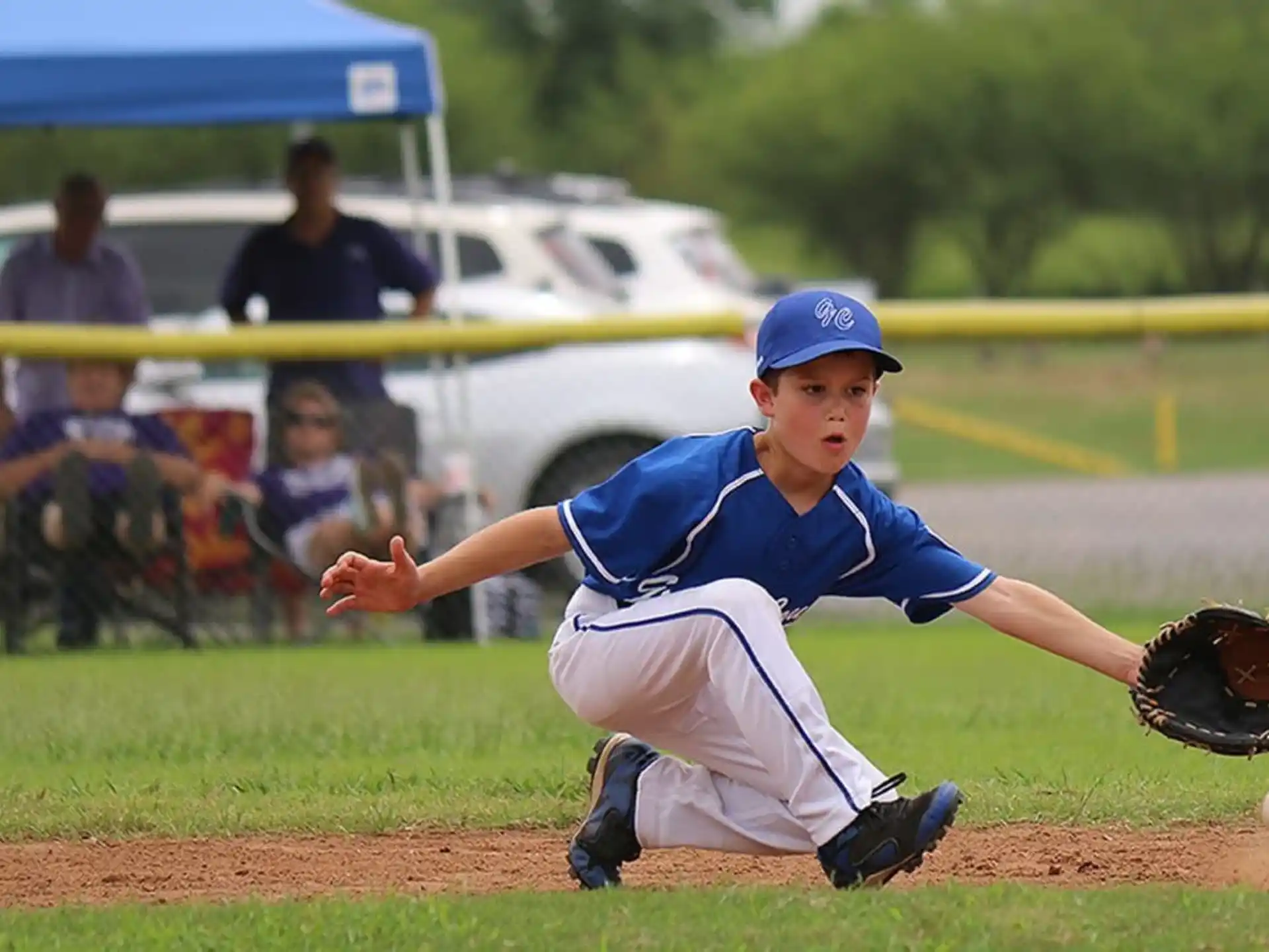 a young boy pitching a baseball