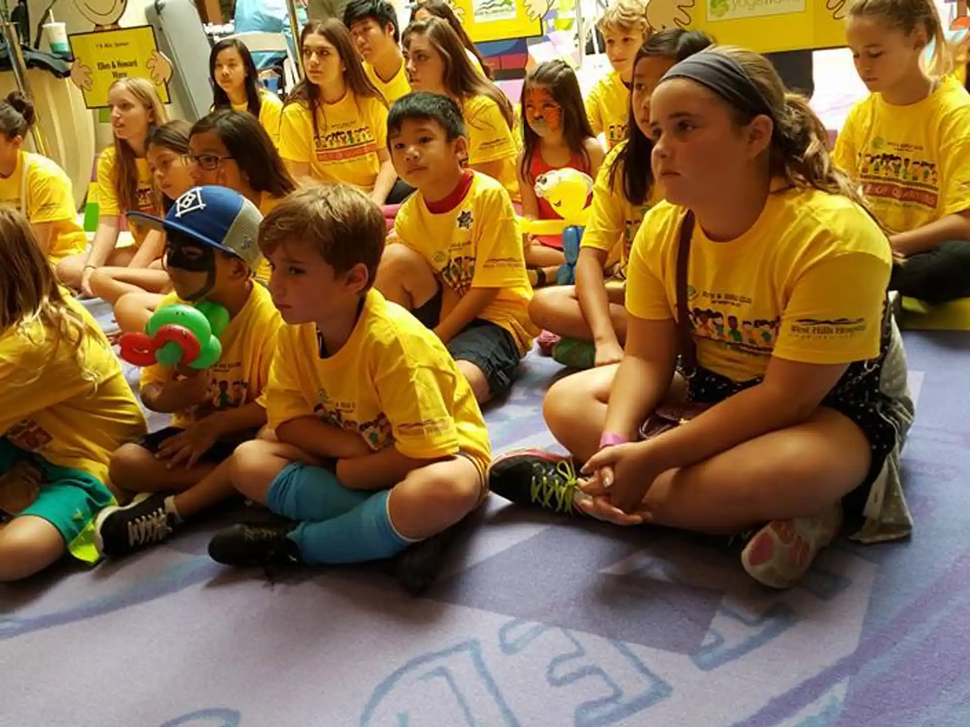 a group of children sitting on the floor