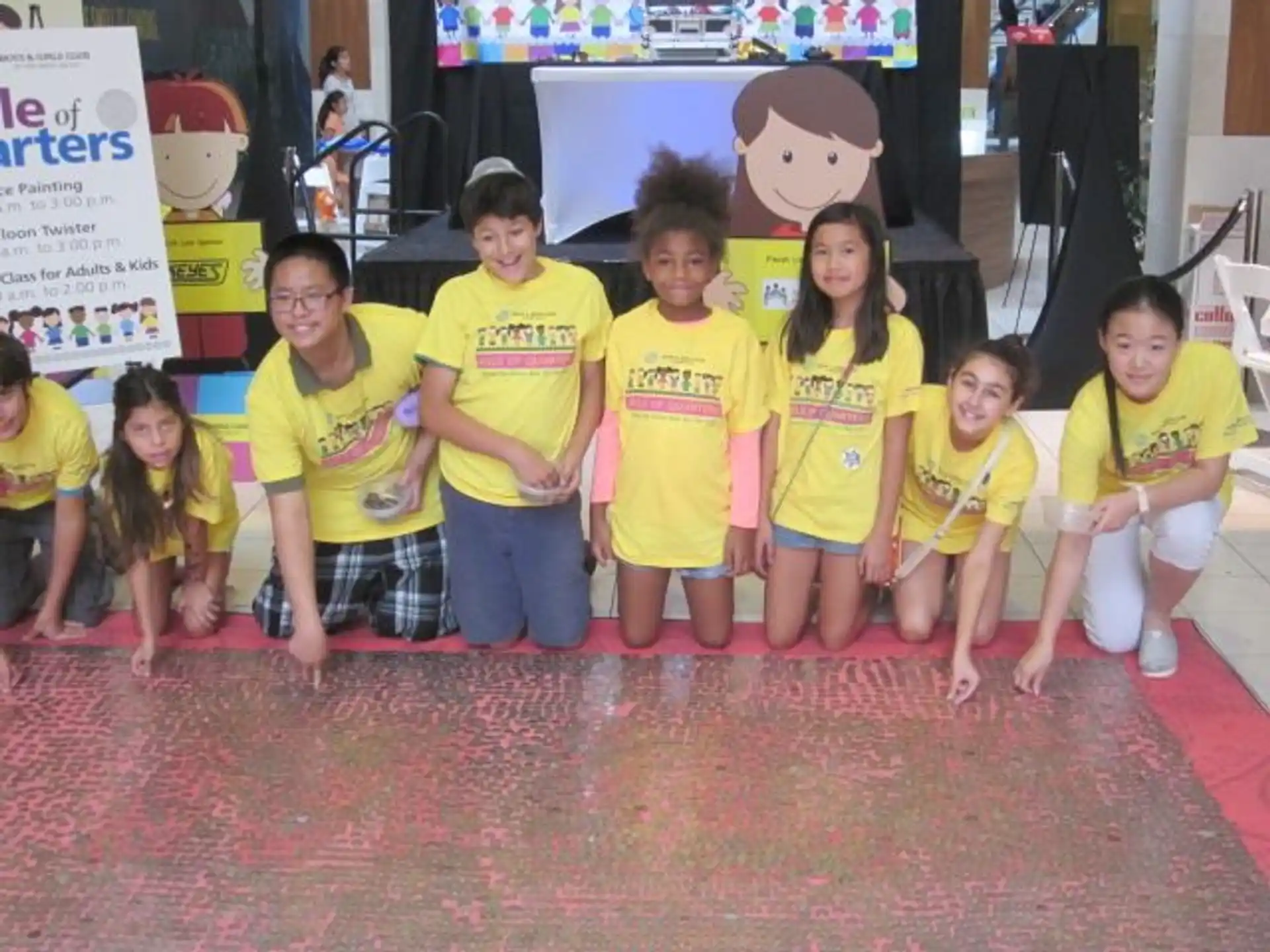 a group of children wearing matching t-shirts