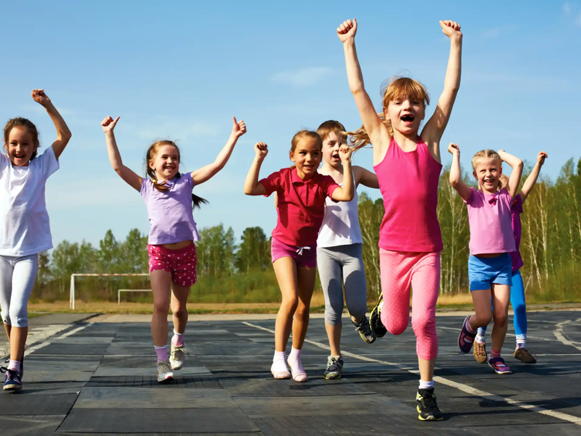 a group of girls jumping in the air
