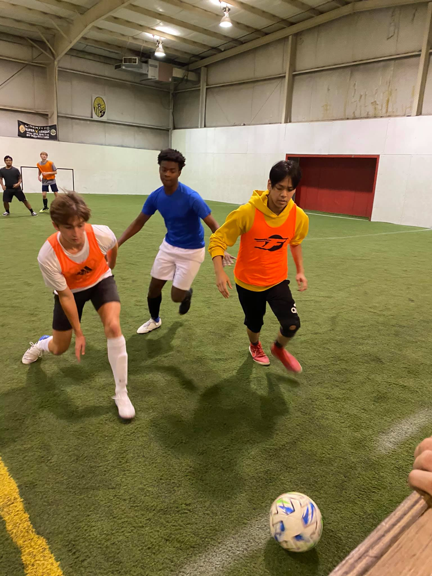a group of people play football