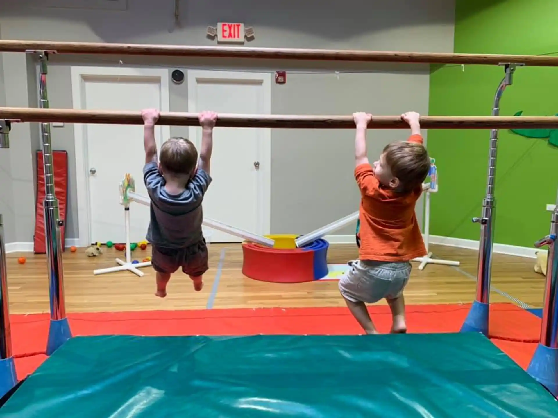 two children playing on a trampoline