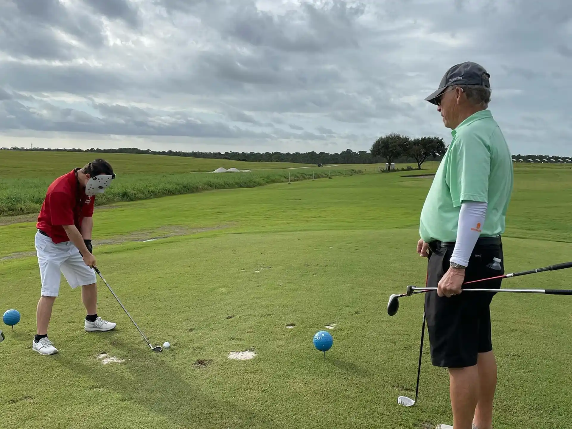 a couple of men playing golf