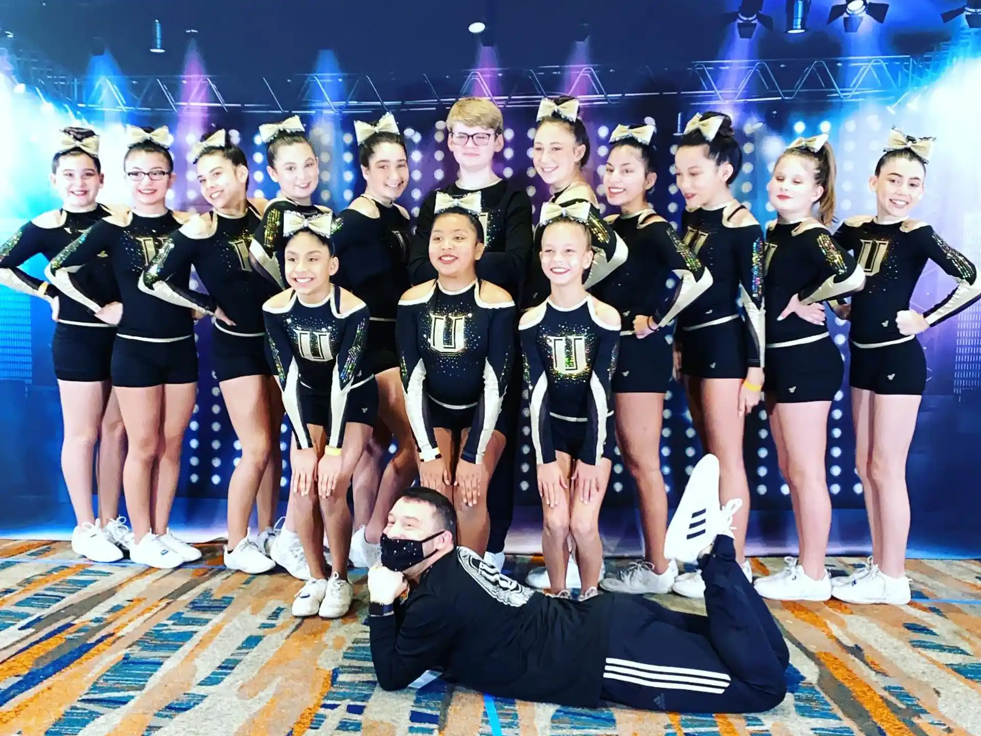 a group of cheerleaders posing for a photo
