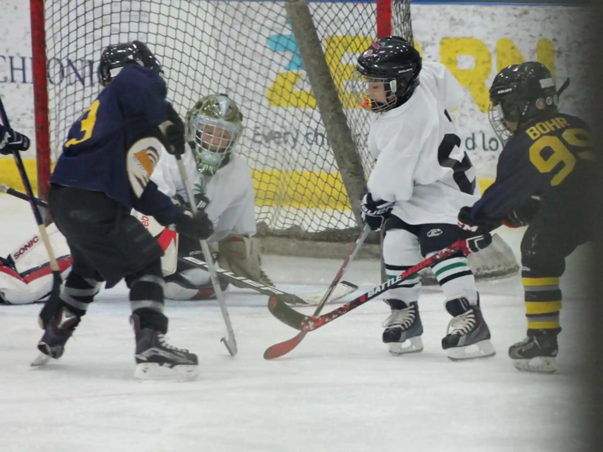 a group of people playing hockey