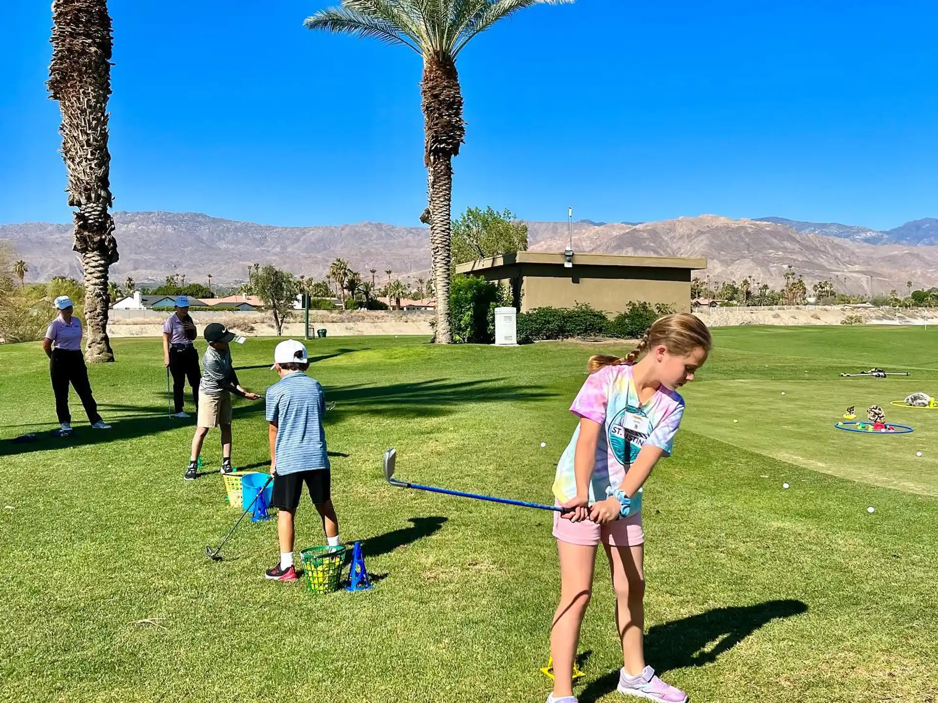 a group of people playing golf