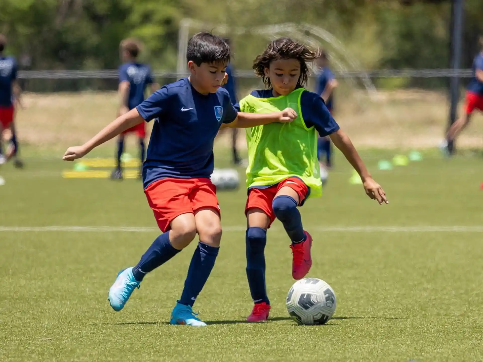 kids playing football on a field