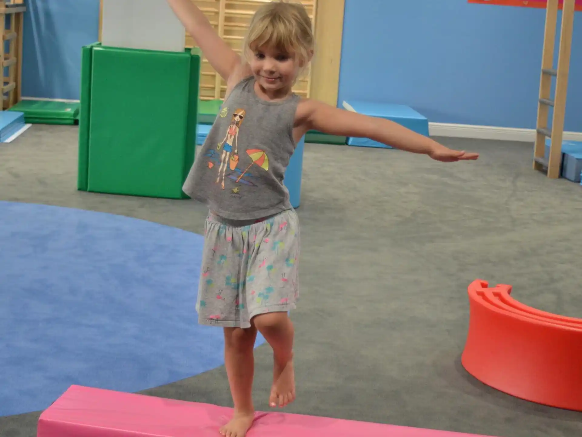 a child standing on a mat