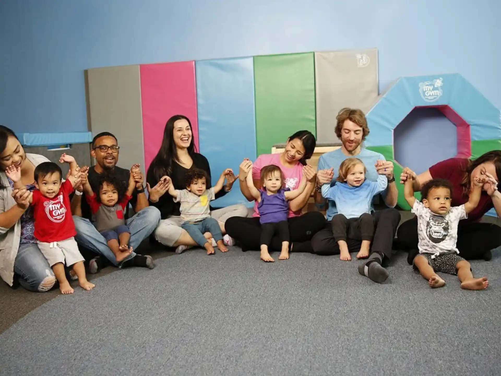 a group of children sitting on the floor