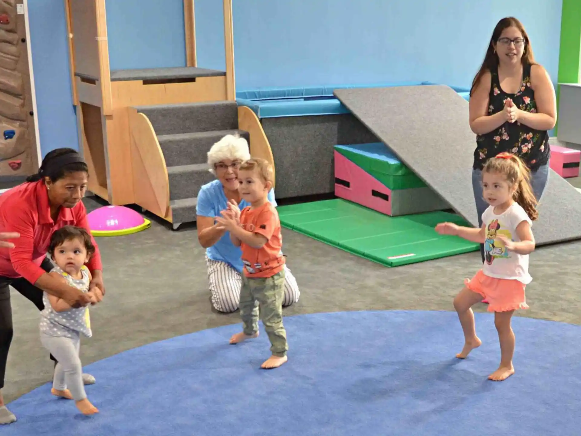a group of people playing with a toy
