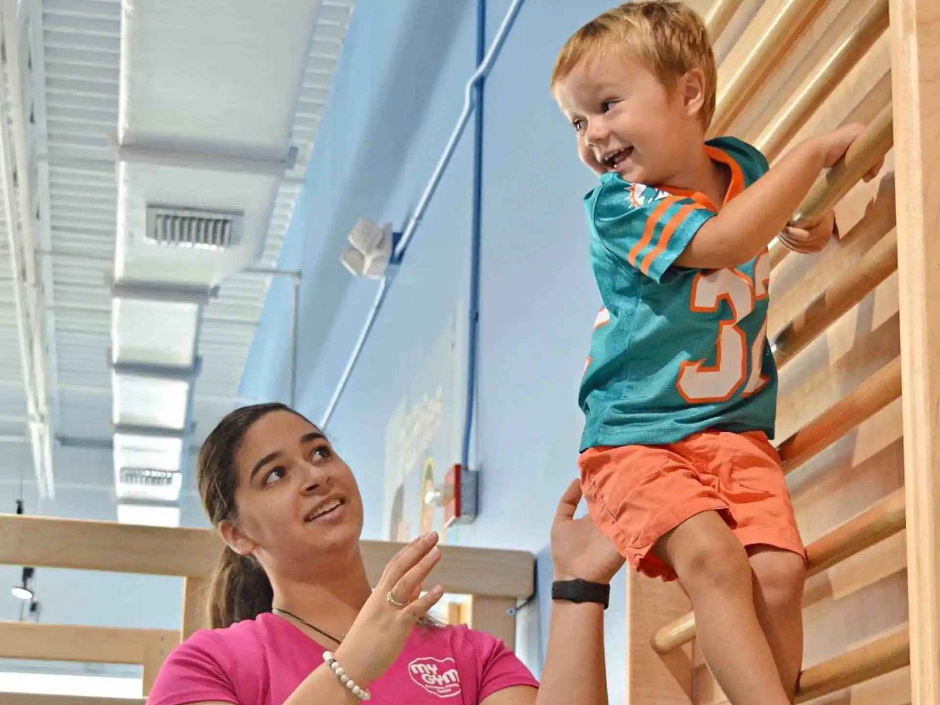 a person holding a child on the shoulders