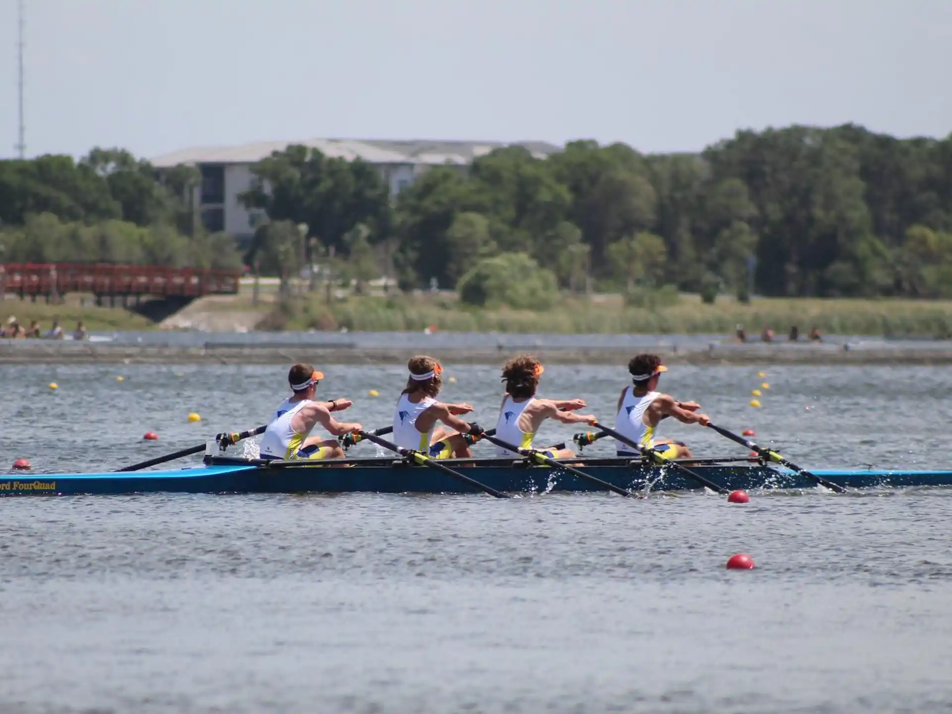 a group of people rowing a boat