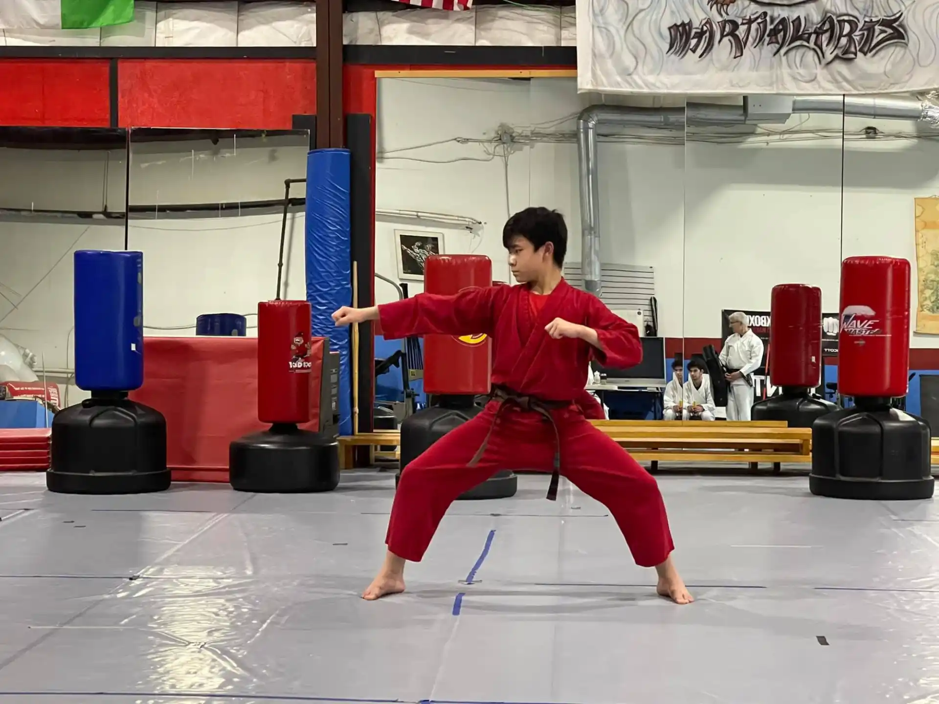 a person in a red karate uniform