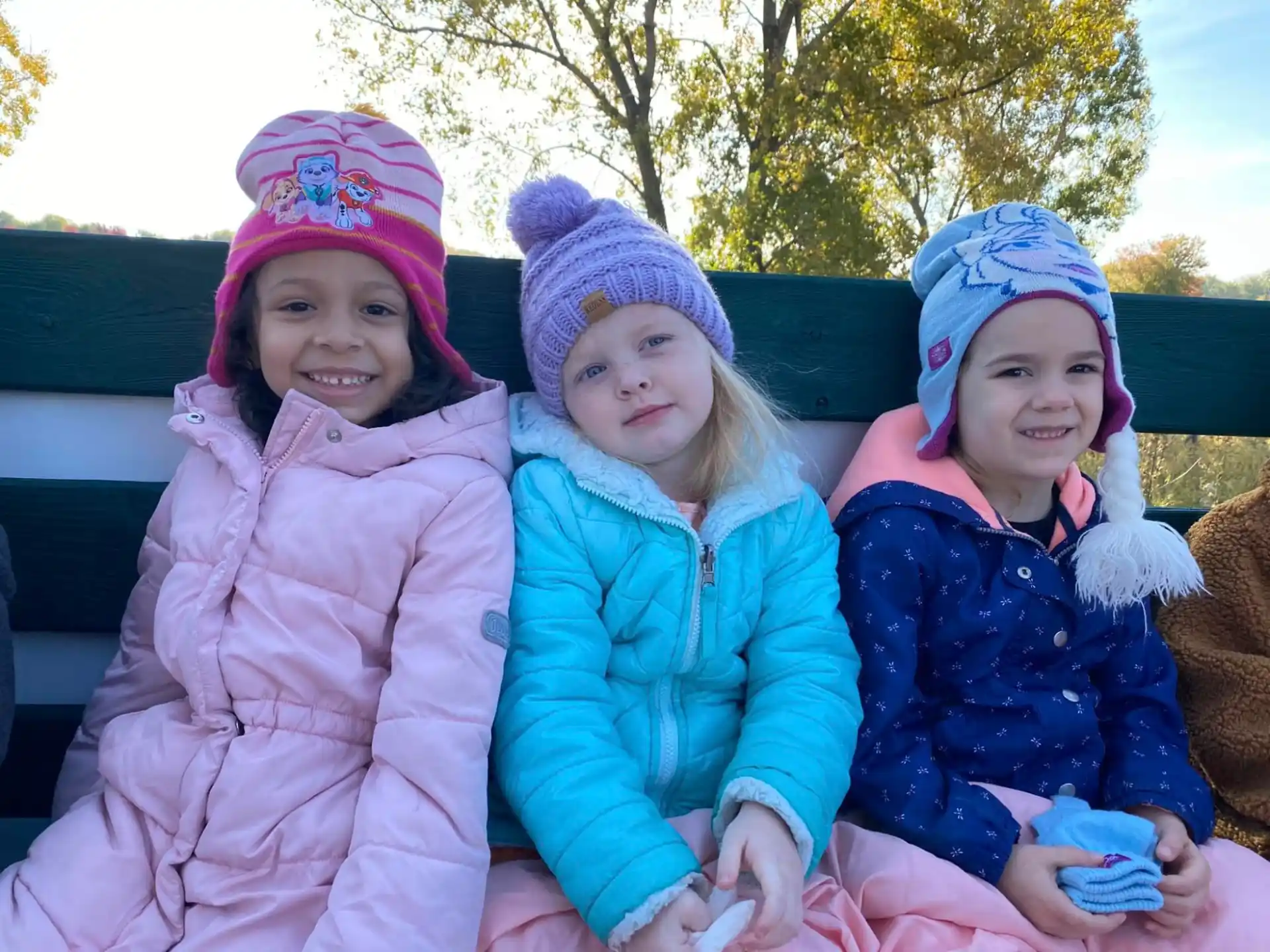 a group of children sitting on a couch