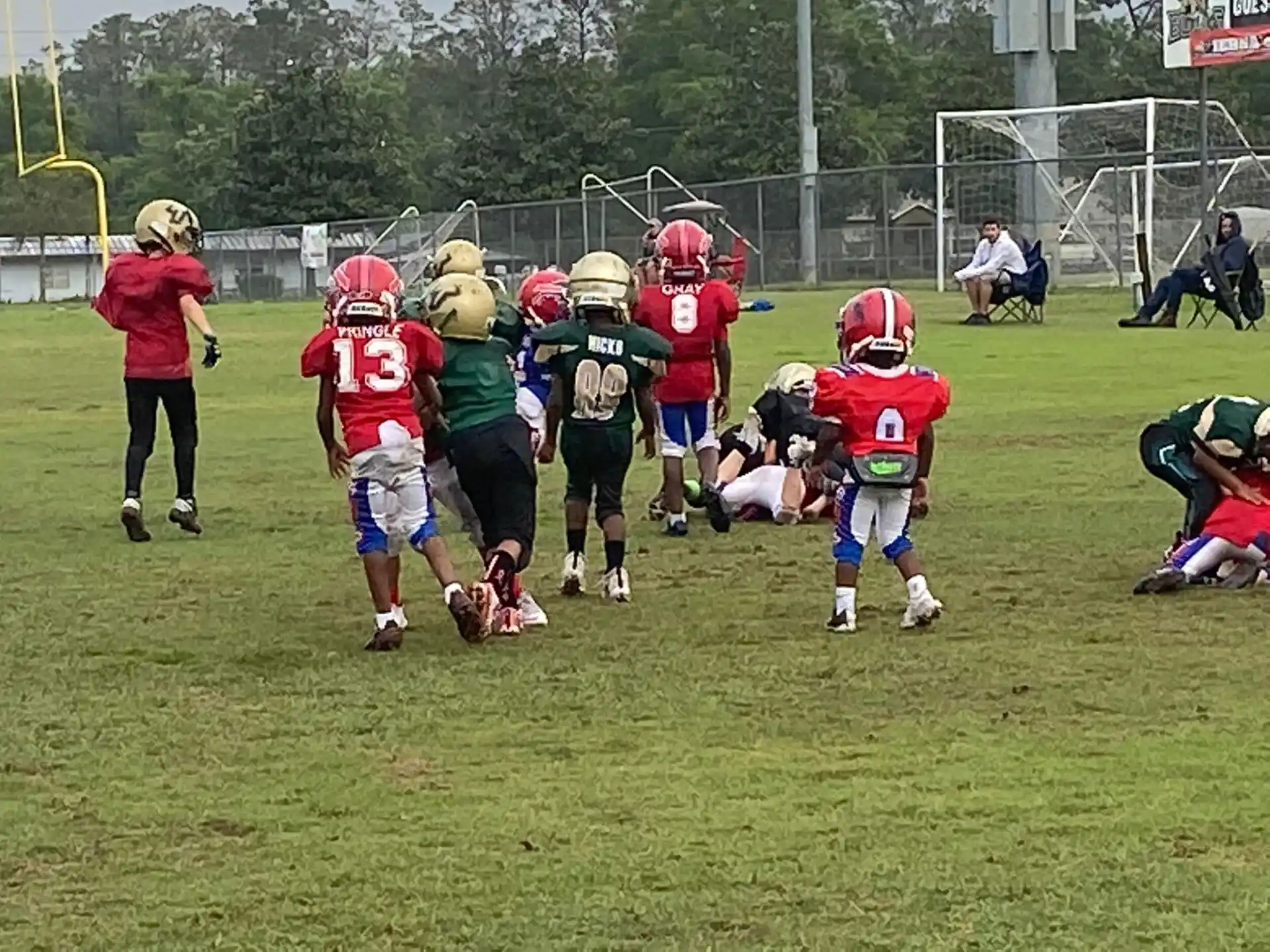 a group of kids playing football