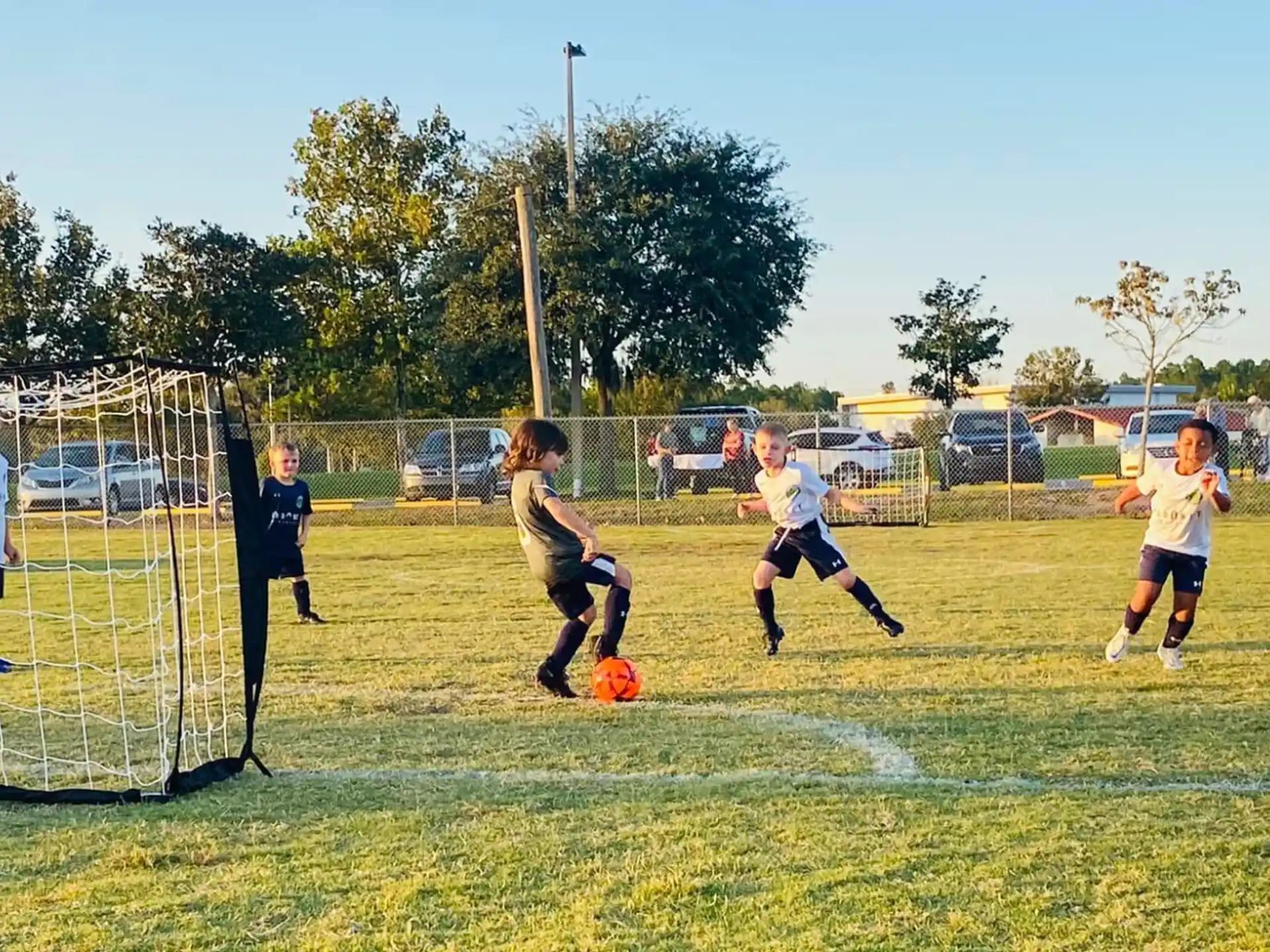 a group of kids playing football