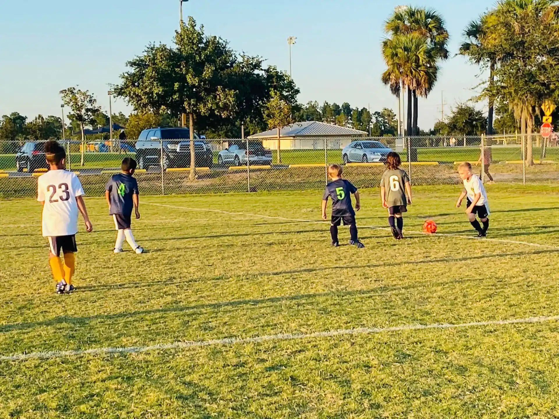 a group of kids playing football
