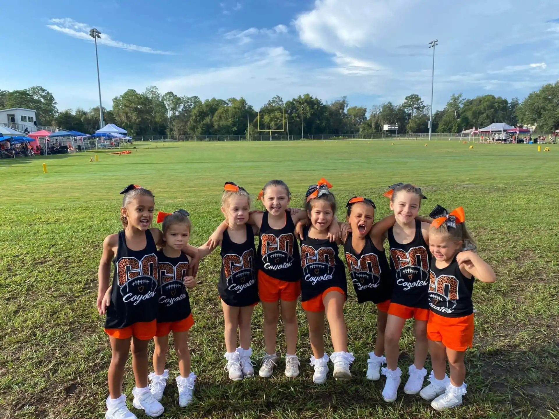 a group of girls in athletic uniforms