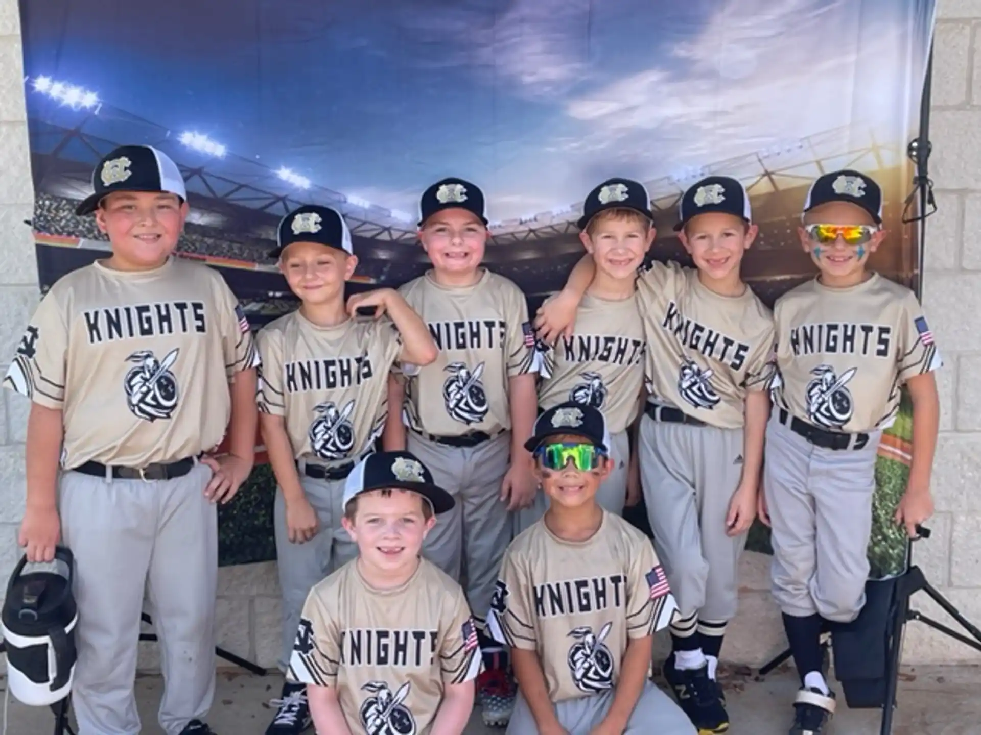 a group of people wearing baseball uniforms