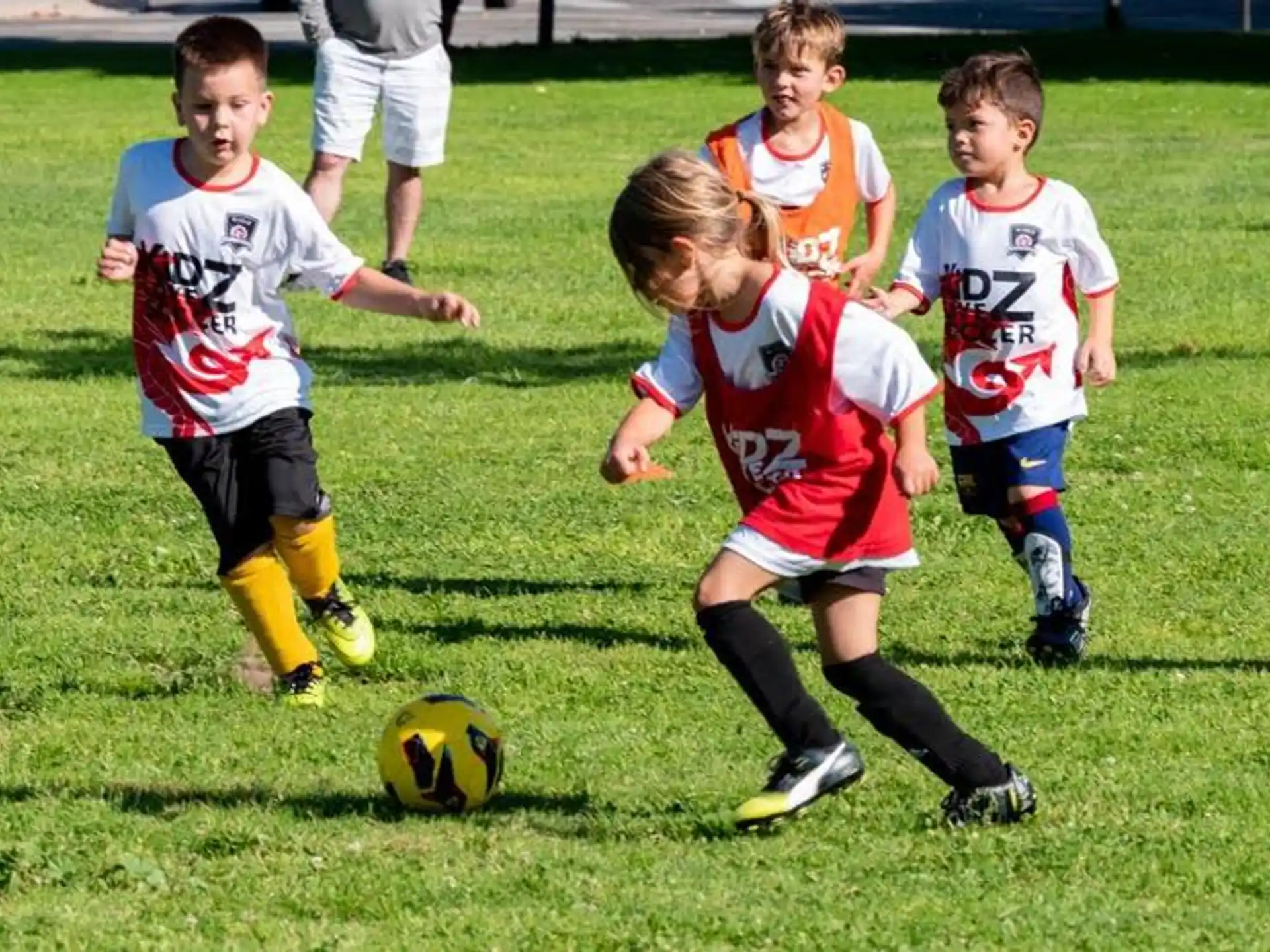 kids playing football on a field