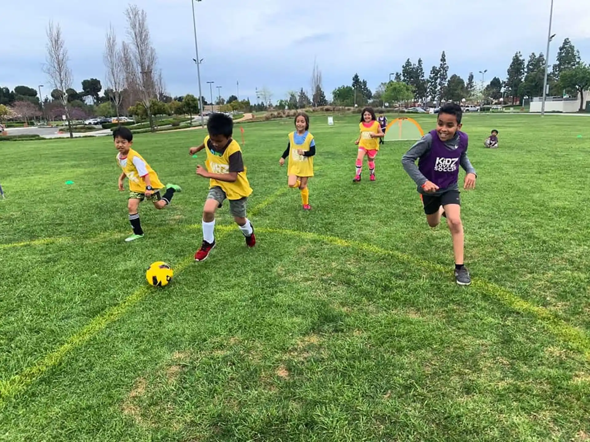 kids playing football on a field