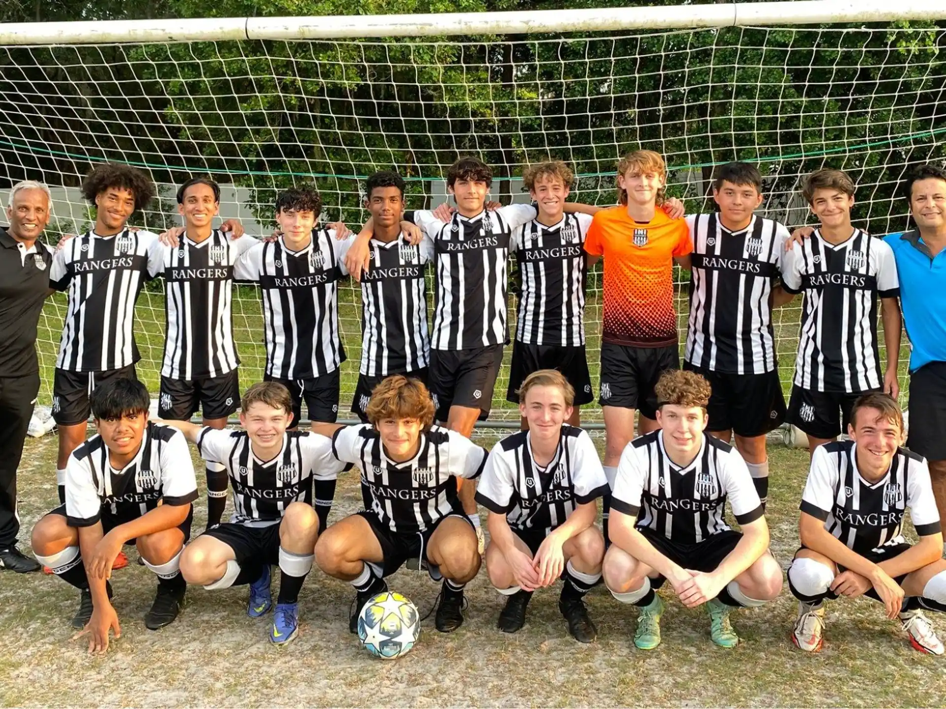 a group of football players posing for a photo