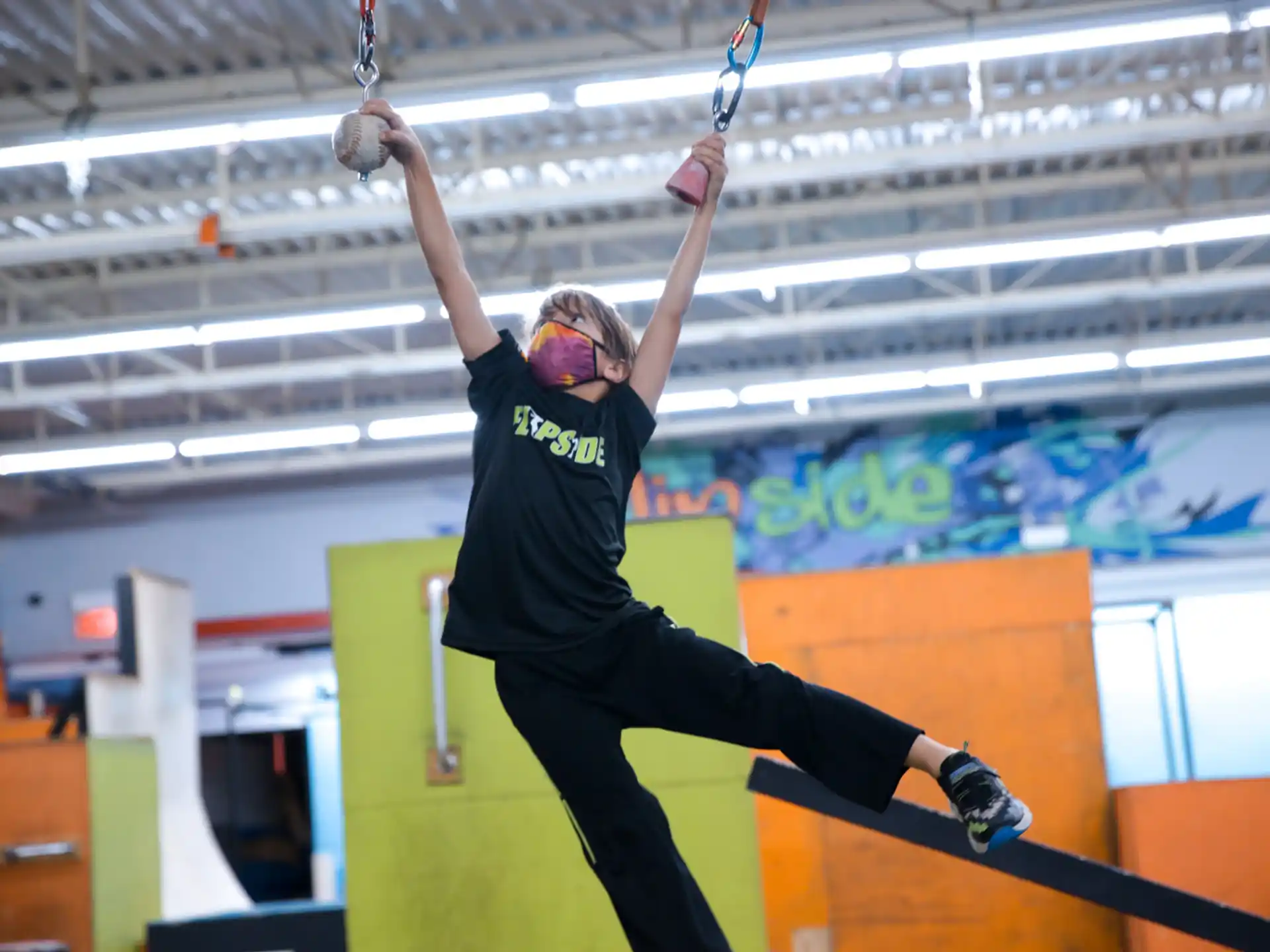 a person jumping with a tennis racket