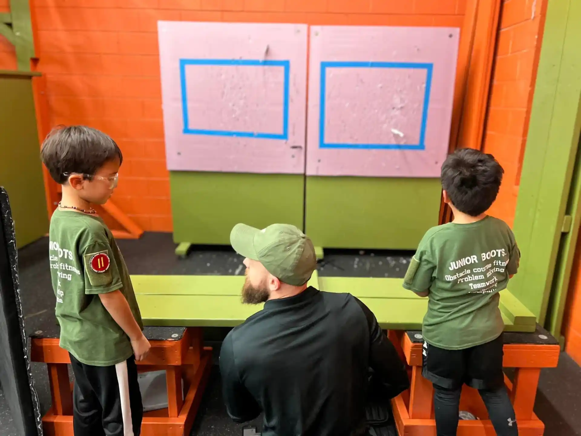a group of kids sitting at a desk