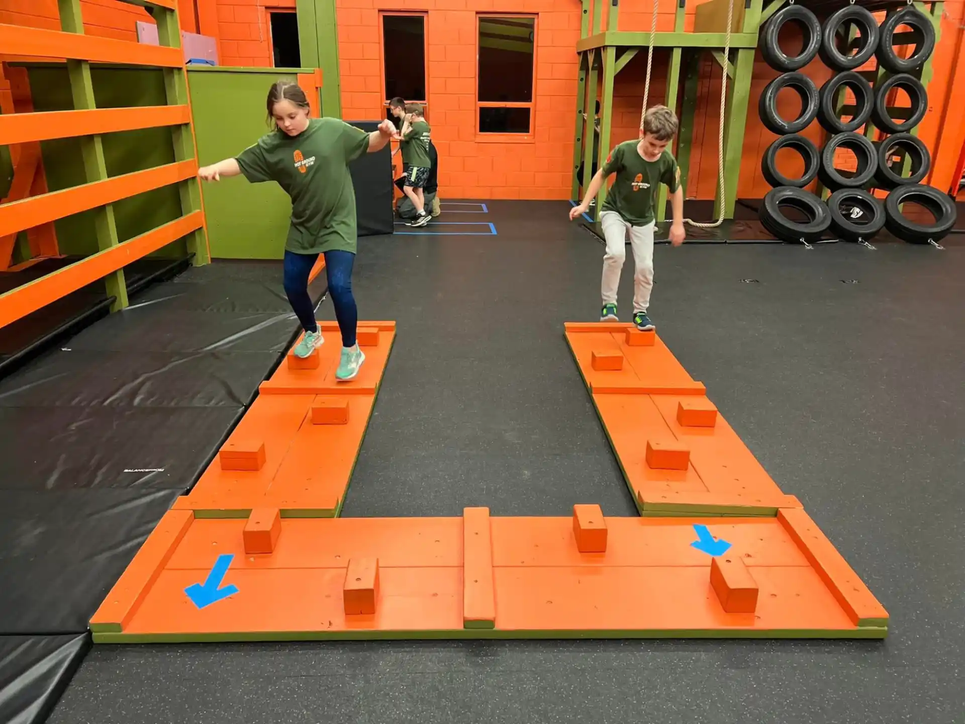 a person taking a picture of a boy skating on a ramp
