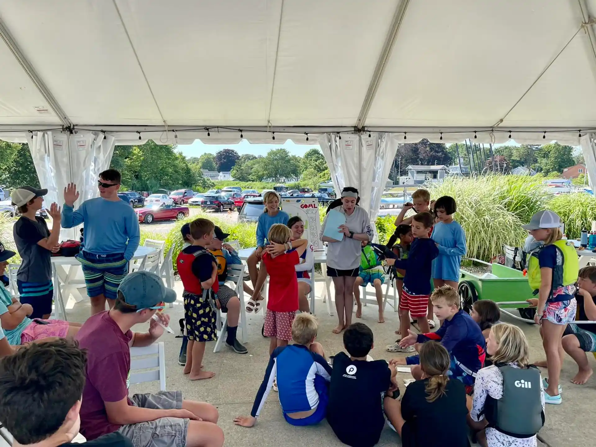 a group of people standing under a tent
