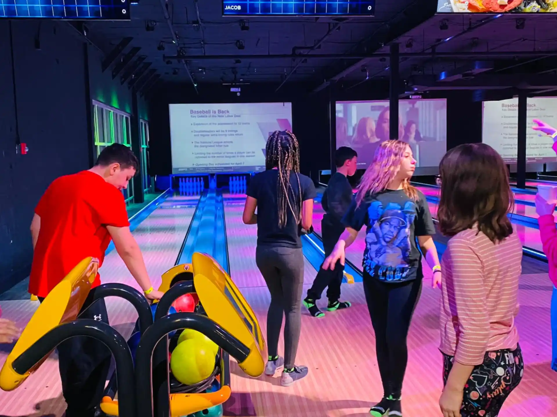 a group of people in a bowling alley