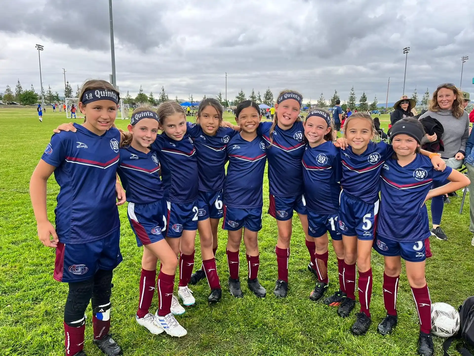 a group of girls in sports uniforms