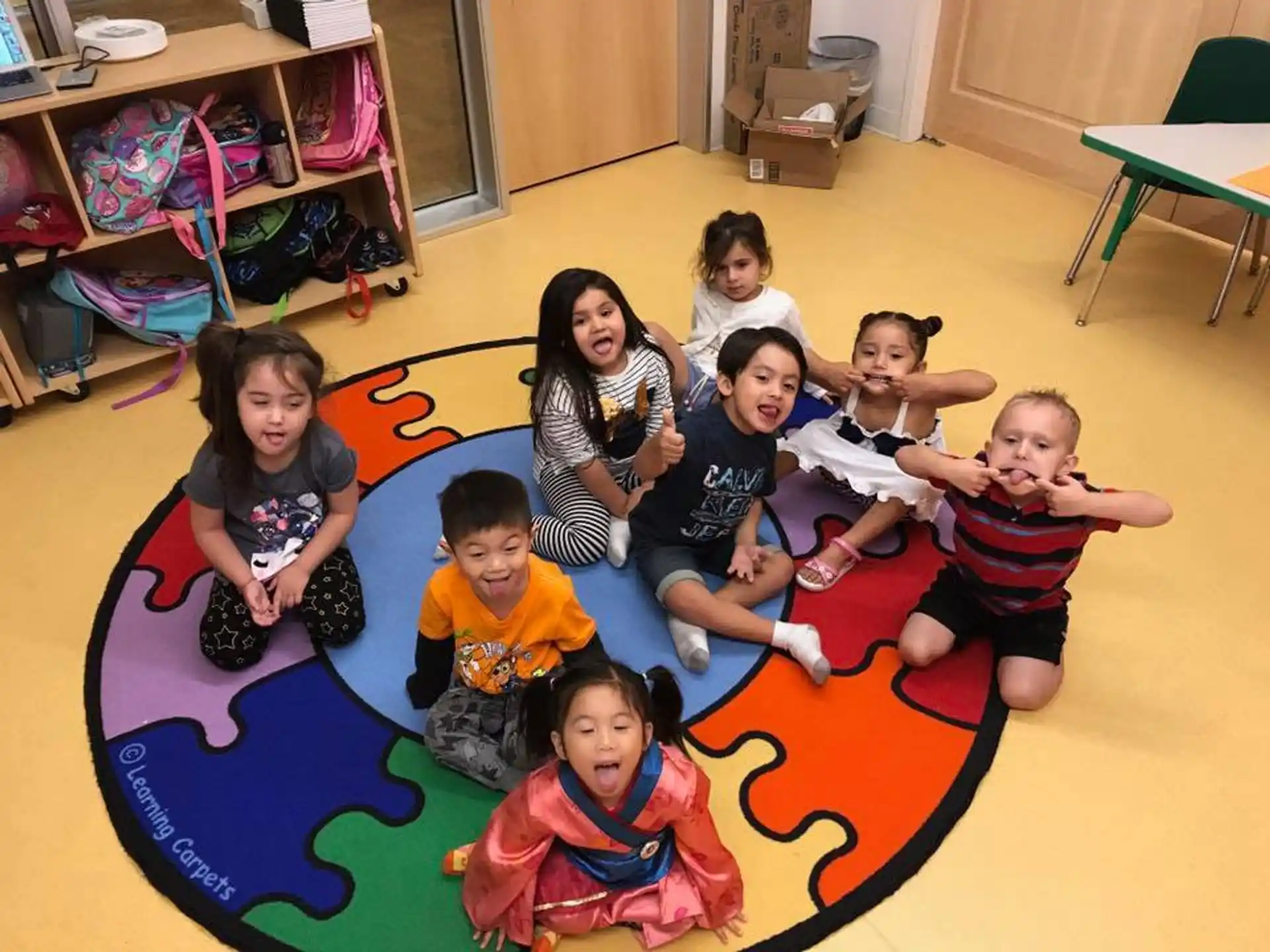 a group of children sitting on the floor
