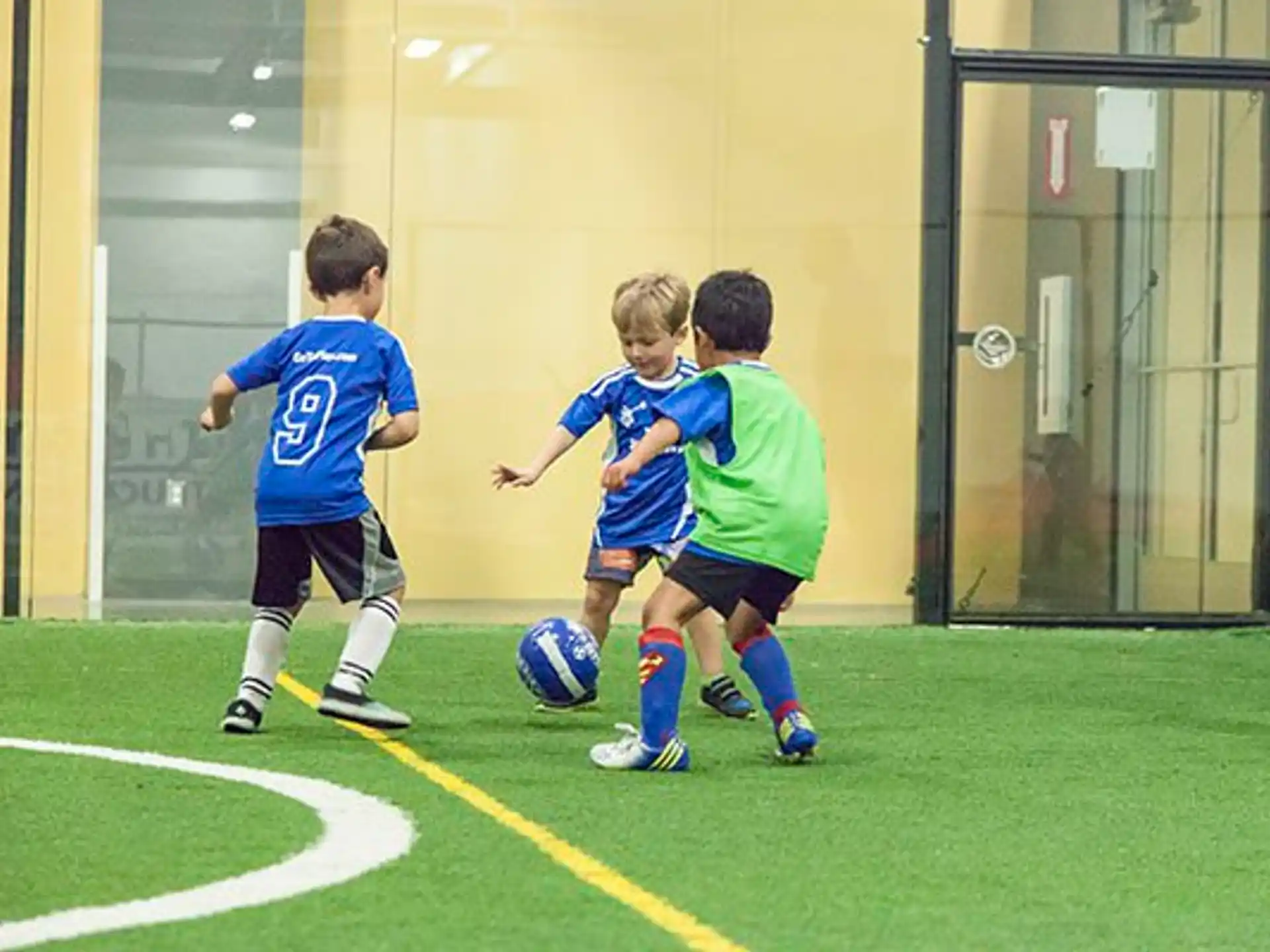 kids playing football on a field