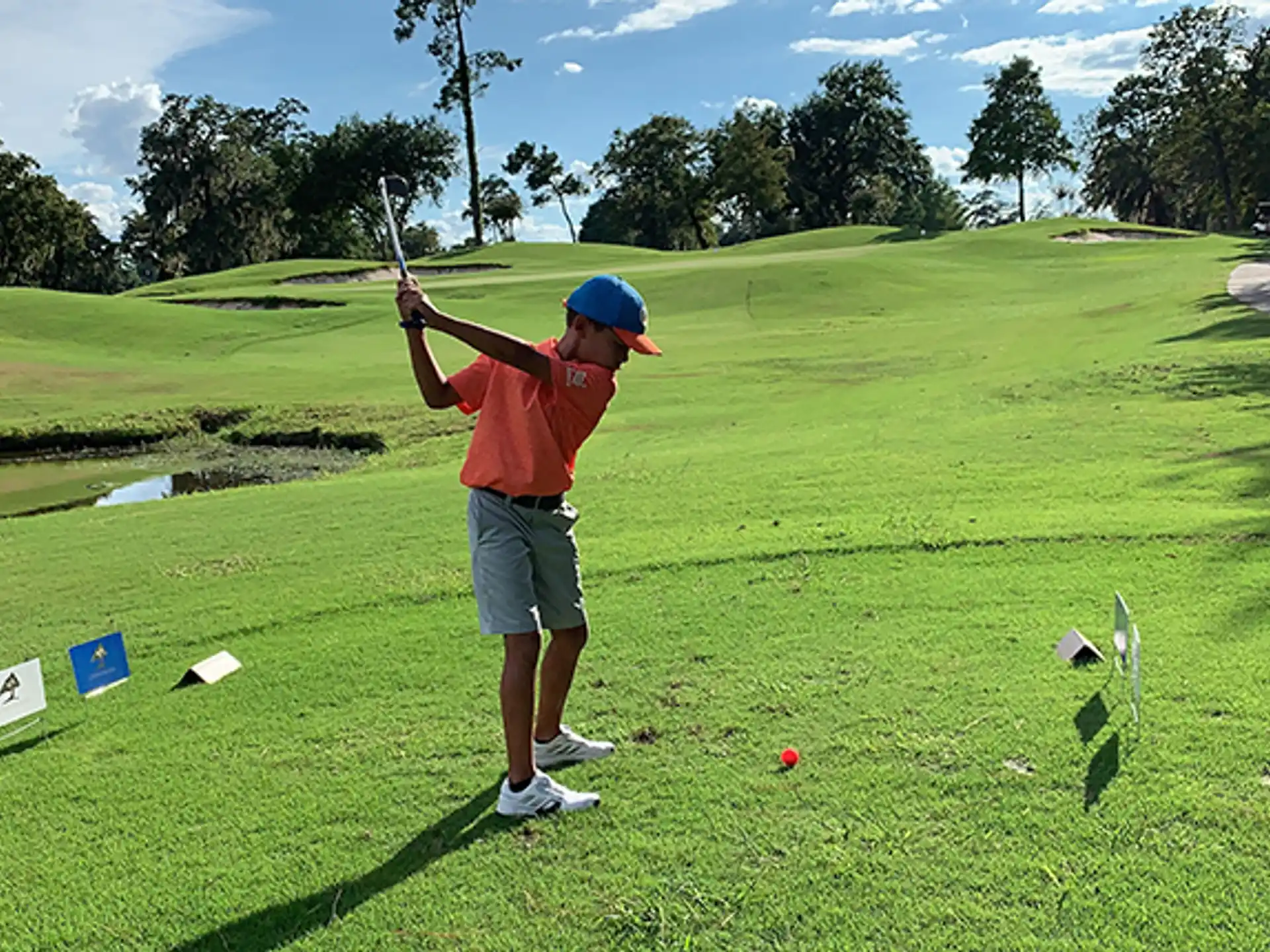 a person swinging a golf club
