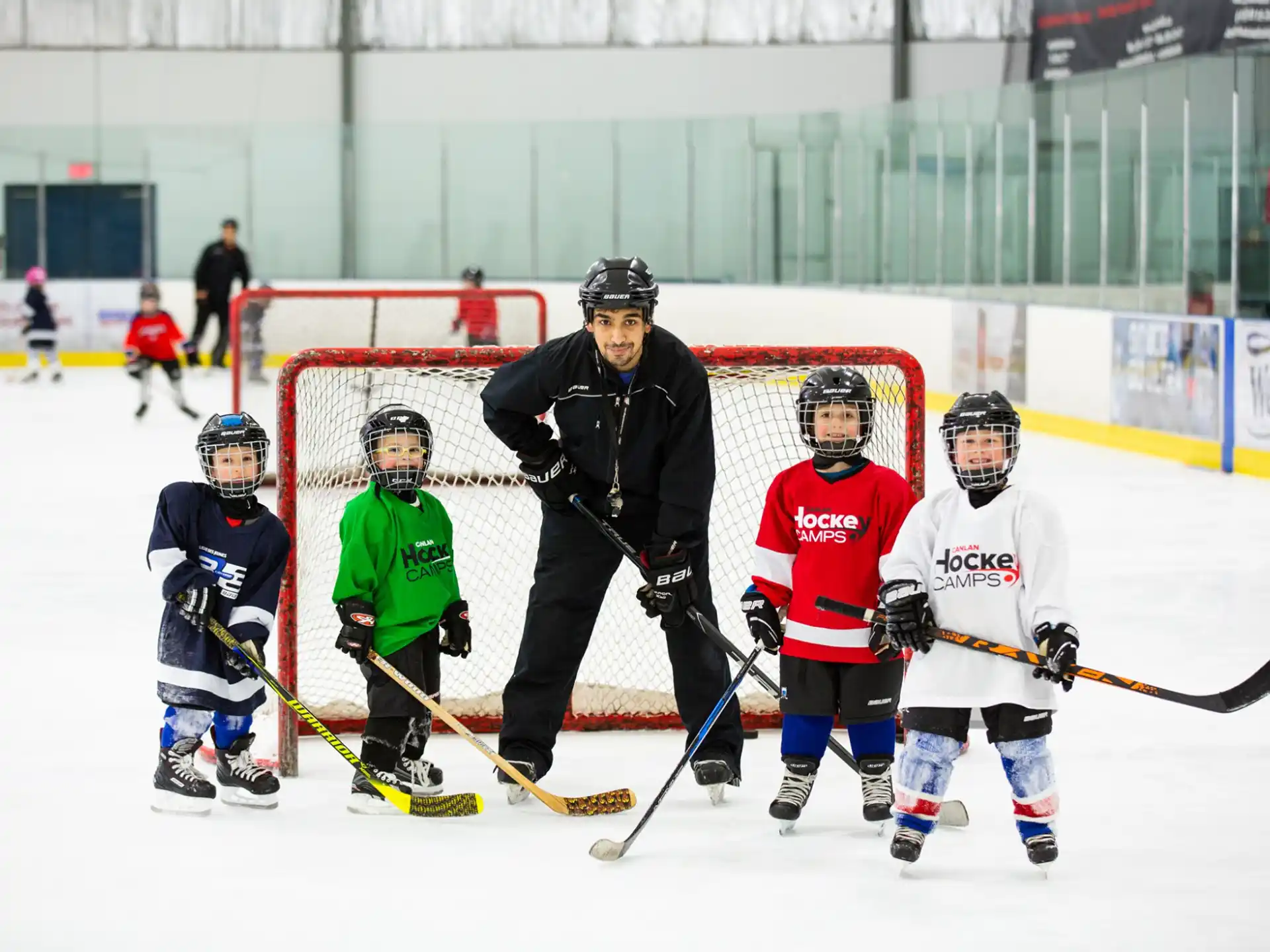 a group of people playing hockey