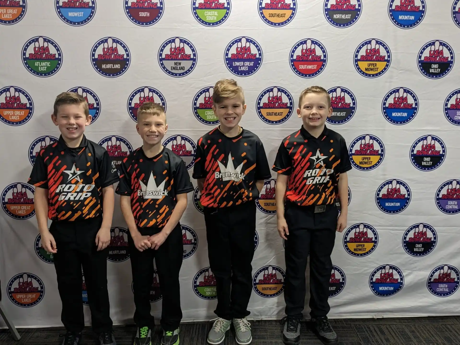 a group of boys in matching t-shirts
