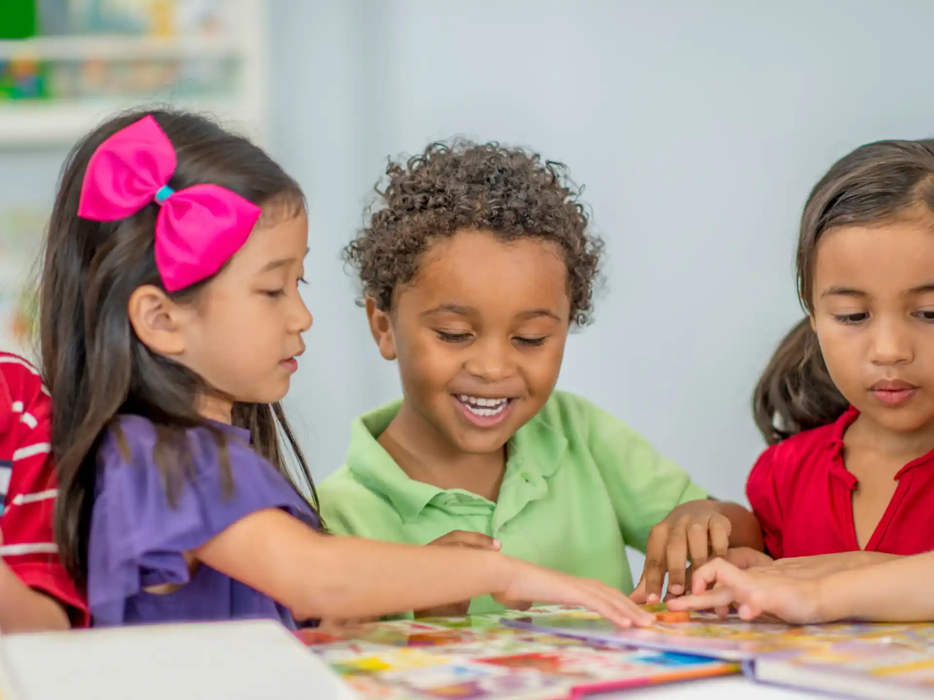 a group of children sitting at a table