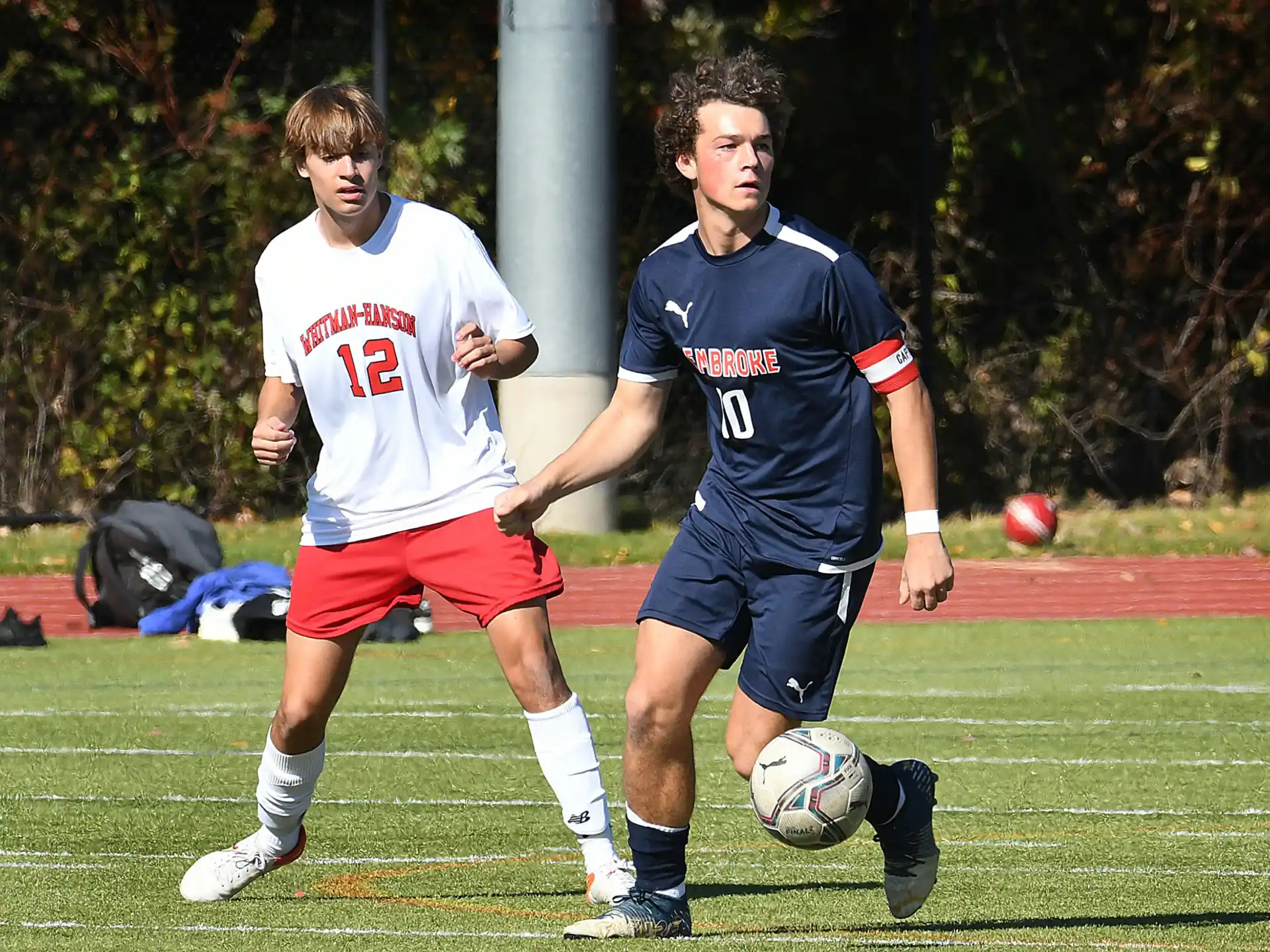 a couple of men playing football