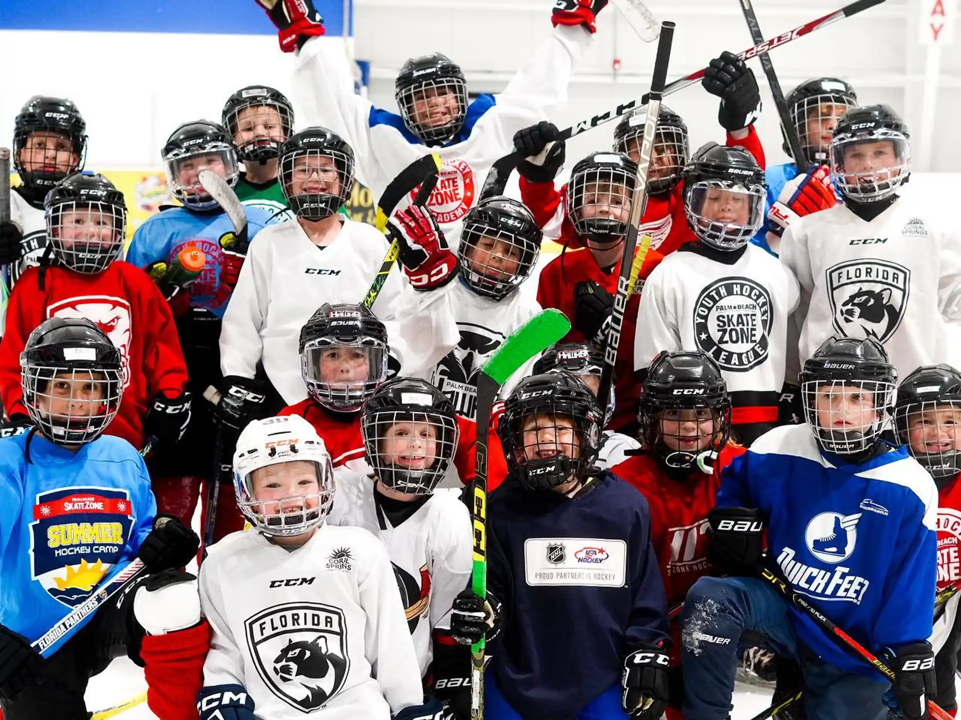 a group of hockey players posing for a photo